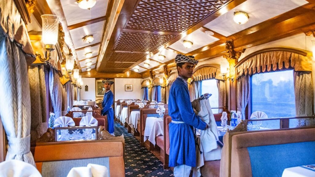 Luxury train India where waiters are setting the table for guests
