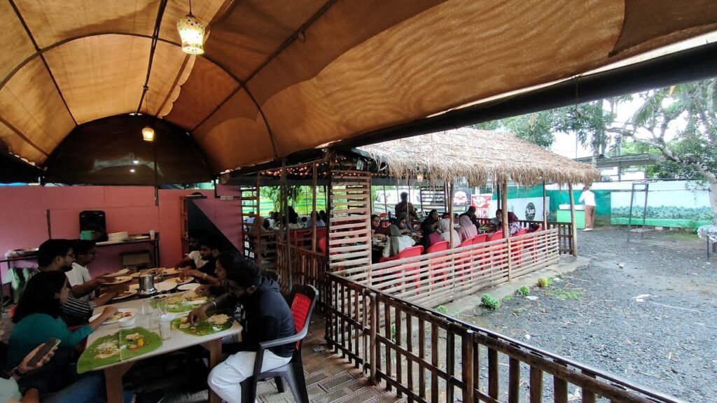 Naas Lunch N Cafe with filled up tables of customers eating thier food on  banana leaf