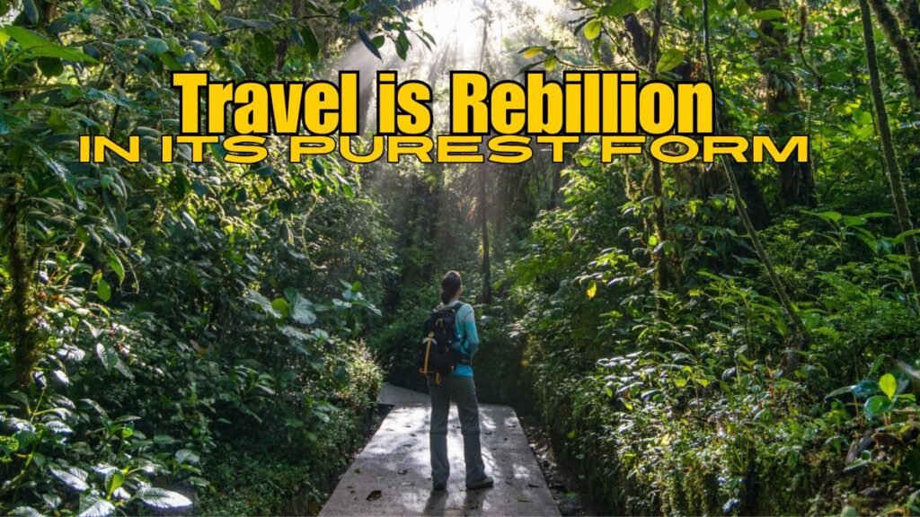 A person standing in the pathway of a forest with a travel quote on topp